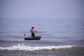 Da Nang, Vietnam, January 16, 2020, Vietnamese fisherman flying inside a round bamboo Royalty Free Stock Photo